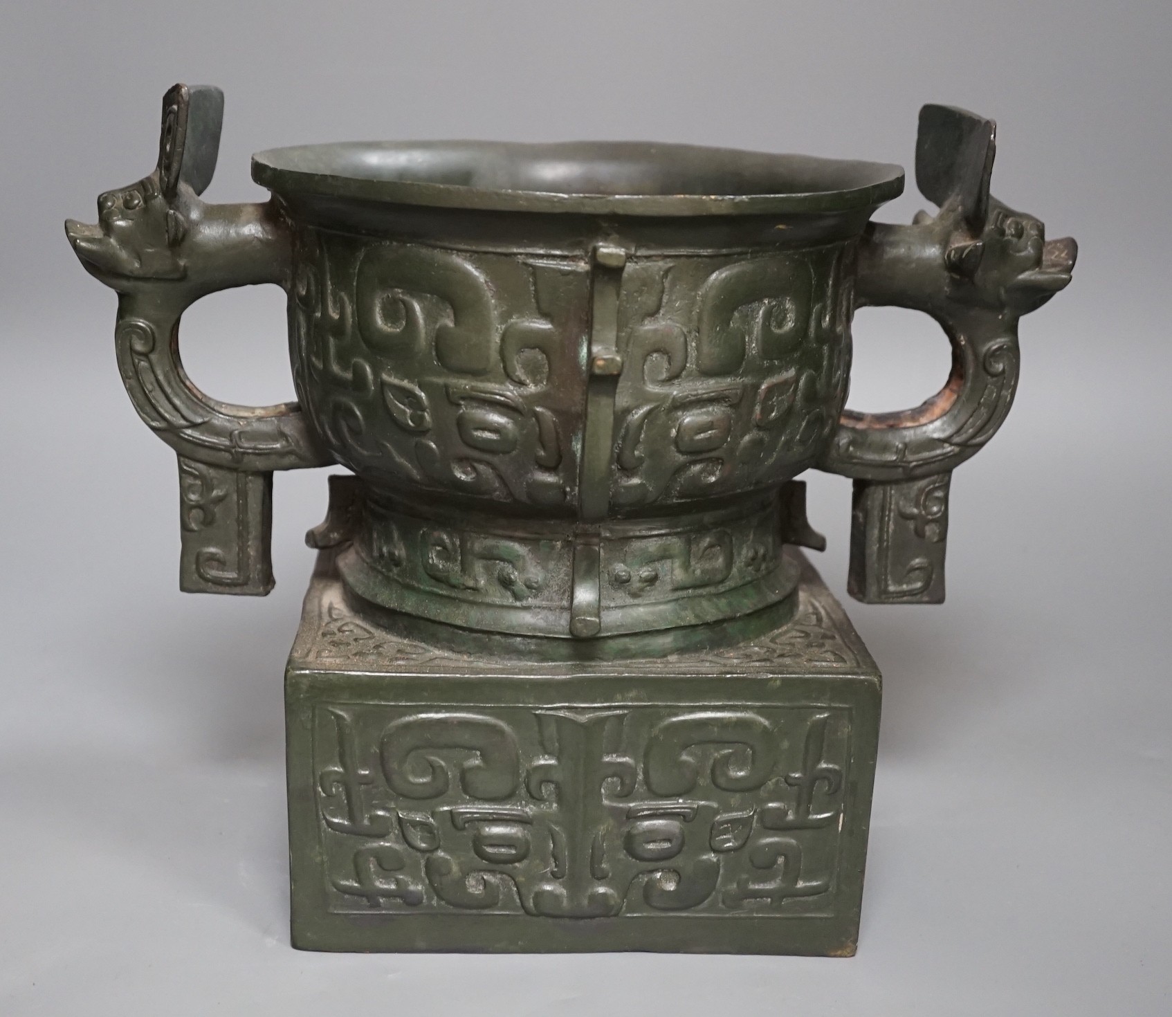 An archaistic Chinese bronze vase after the antique, modelled as an original bronze in the collection of the Palace Museum, Beijing, boxed with certificate, cast number 35. 25.5cm tall